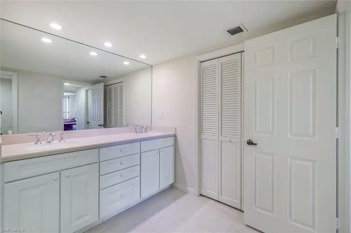 Bathroom featuring tile patterned floors and vanity