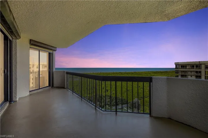 Balcony at dusk with a water view