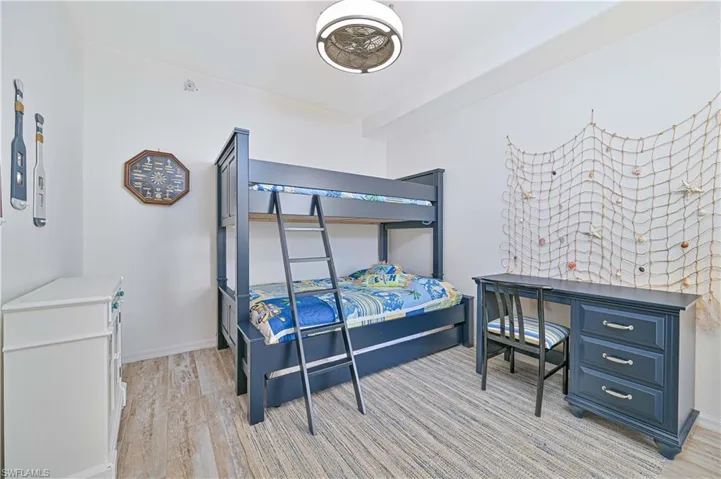 Bedroom featuring light wood finished floors and baseboards