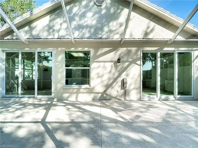 Rear view of property featuring a patio