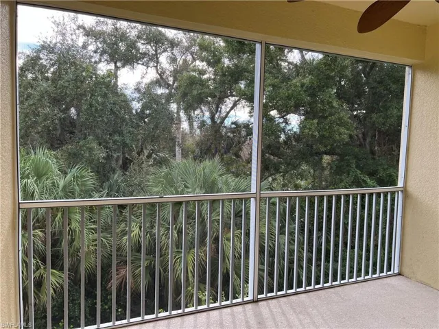 Screened Balcony with ceiling fan overlooking wooded preserve area