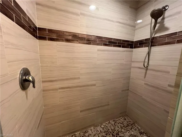 Master Bathroom featuring a tile shower