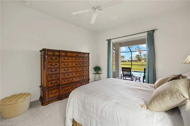 Bedroom with ceiling fan, carpet, and access to exterior