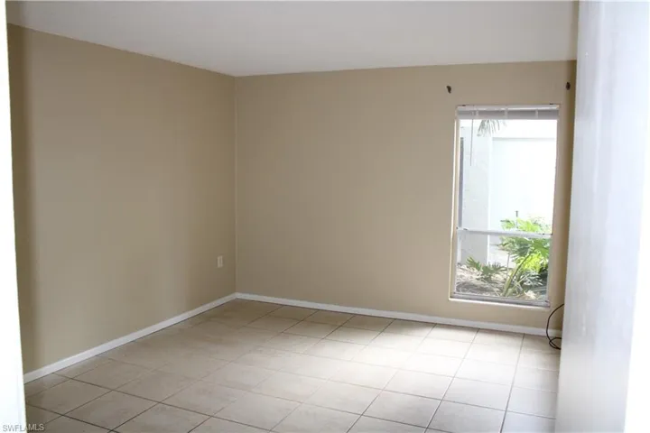 Spare room featuring light tile patterned floors