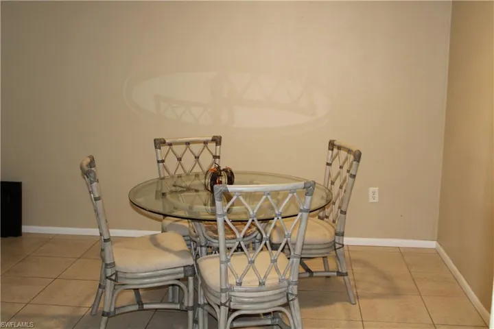 Dining room with light tile patterned floors