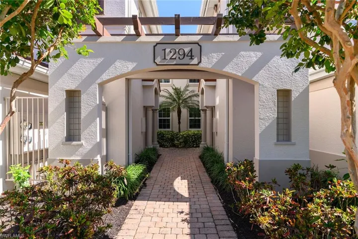 Doorway to property with stucco siding.