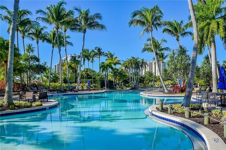 Resort-style pool with lap lanes at one end and a hot tub.
