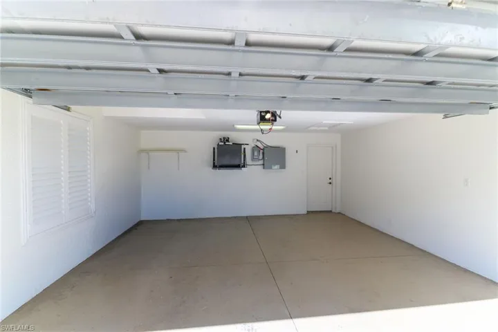 Garage with a garage door opener.