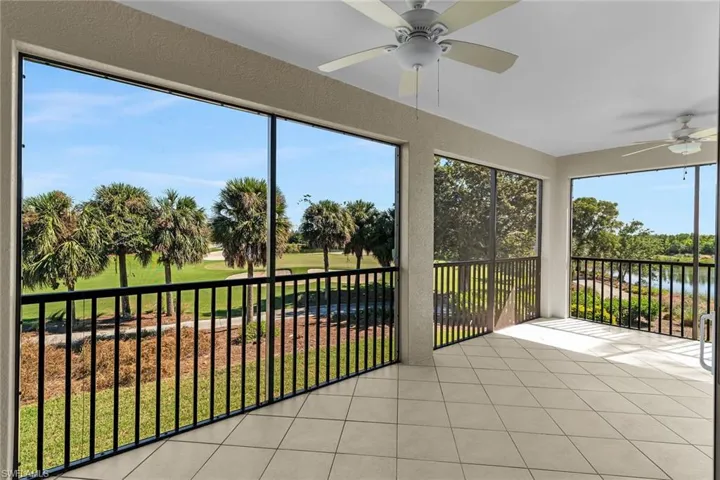 Lanai featuring tile patterned flooring, a ceiling fan, a water view, and golf course view.
