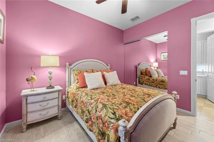 Living room with ornamental molding, baseboards, a ceiling fan, and visible vents