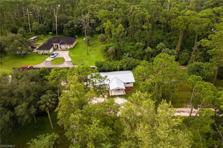 View from above of property with a forest