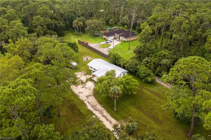 View from above of property with a heavily wooded area