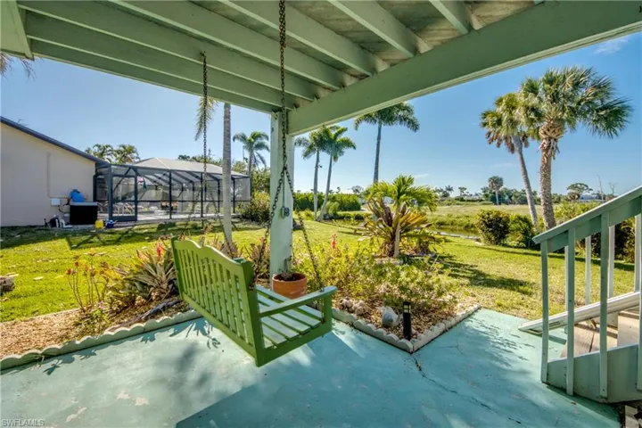 Patio with swing & view of the pond