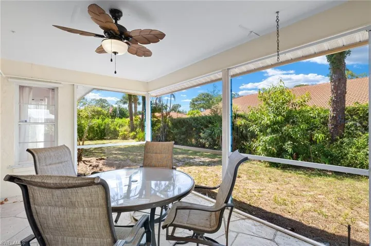 Sunroom featuring ceiling fan