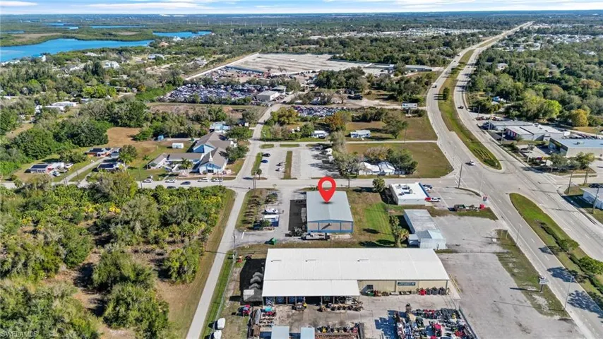 Aerial overview of property's location with a large body of water