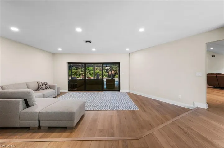 Living room with light wood-type flooring