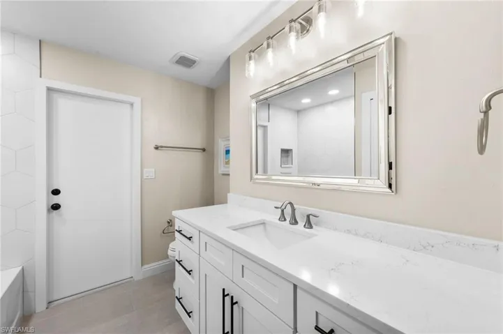 Bathroom with vanity and toilet