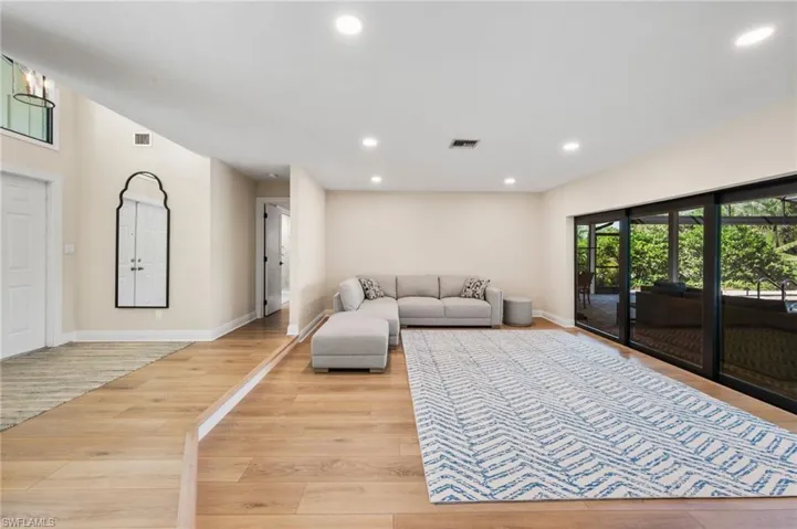Living room with light wood-type flooring