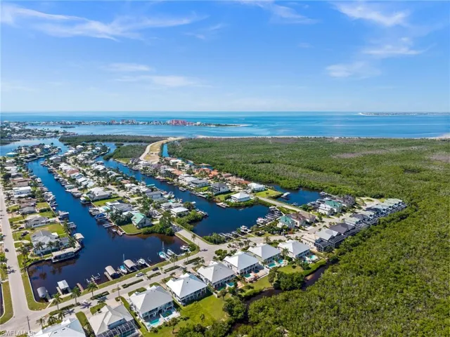Aerial perspective of suburban area with a nearby body of water
