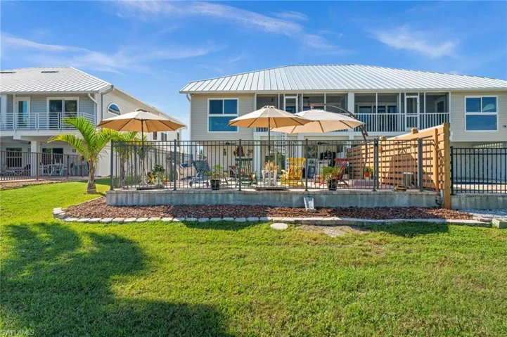Rear view of house featuring a patio area