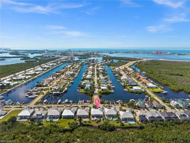 Aerial perspective of suburban area with a large body of water