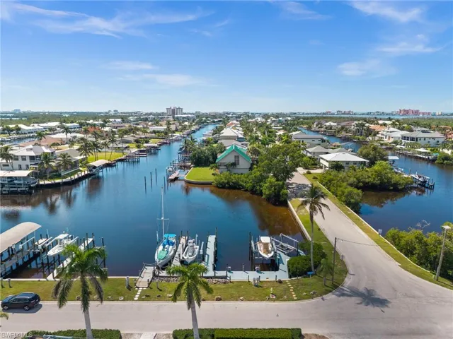 Aerial perspective of suburban area with a large body of water