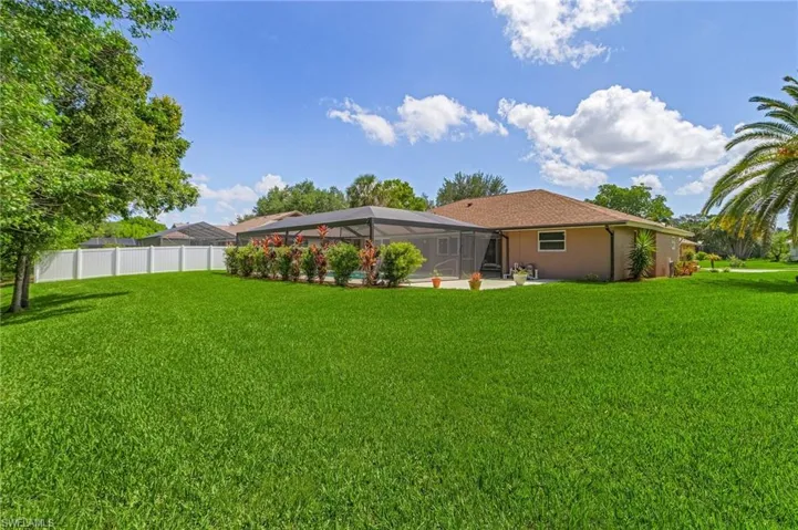View of yard featuring a lanai and a patio area
