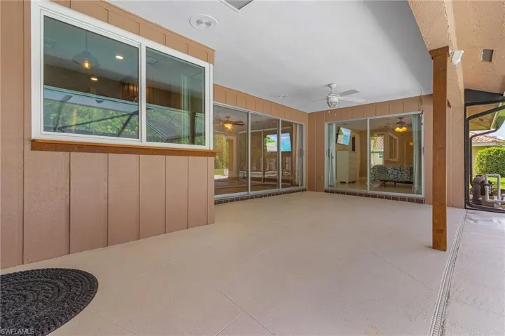 View of patio featuring a ceiling fan