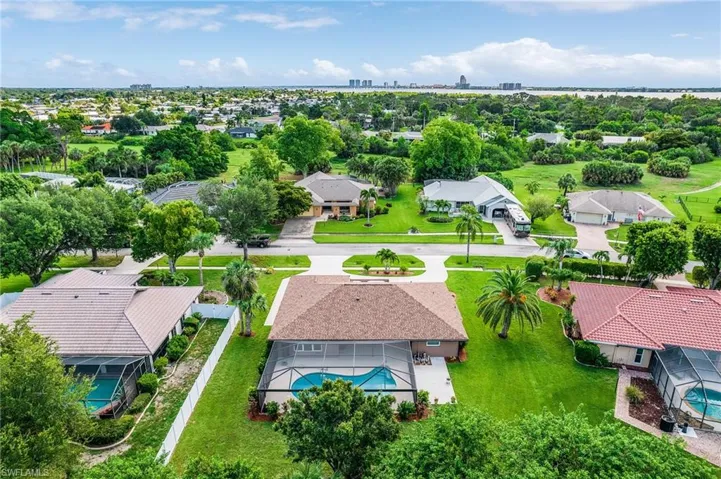Aerial view of residential area featuring a pool area