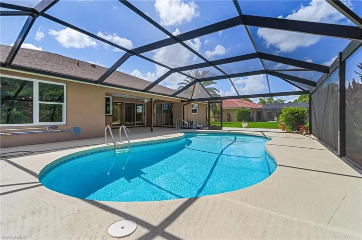 Outdoor pool featuring a patio and a lanai