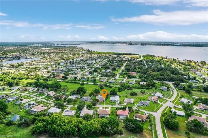 View of property location with nearby suburban area