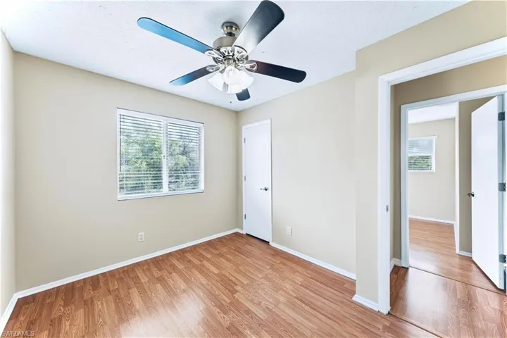 Unfurnished bedroom with light hardwood / wood-style flooring and ceiling fan