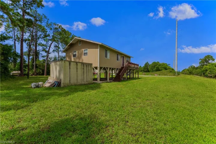 View of yard with a deck
