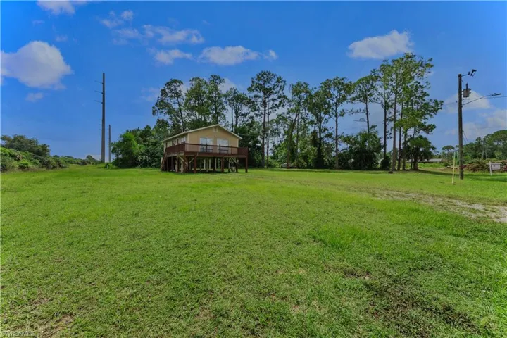 View of yard with a deck