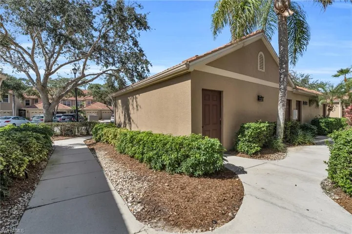 View of side of property featuring stucco siding