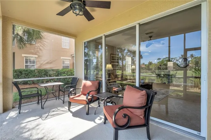 Sunroom / solarium featuring ceiling fan