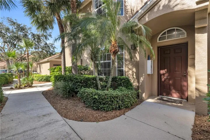 Entrance to property featuring stucco siding