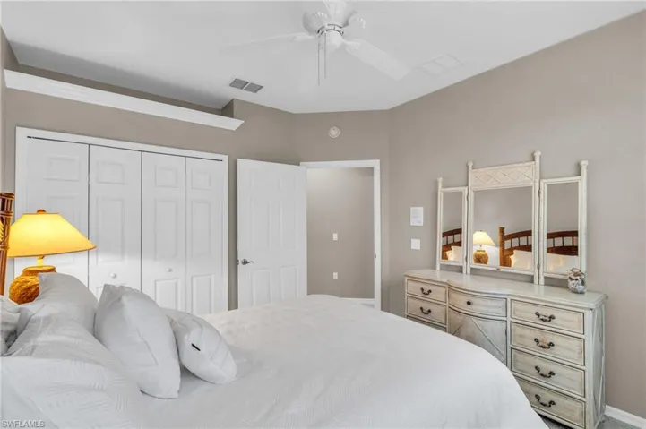 Bedroom with a closet and a ceiling fan