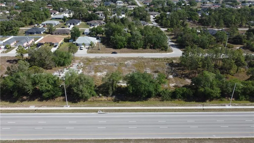 Birds eye view of property with a residential view