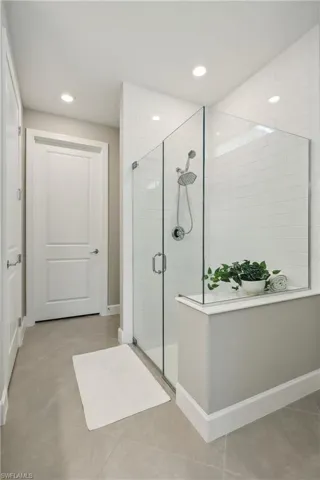 Bathroom with a shower with door