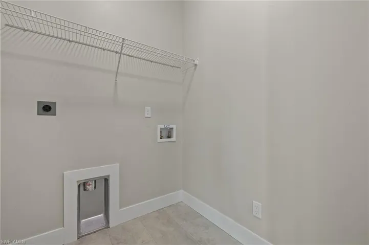 Laundry room with electric dryer hookup and hookup for a washing machine