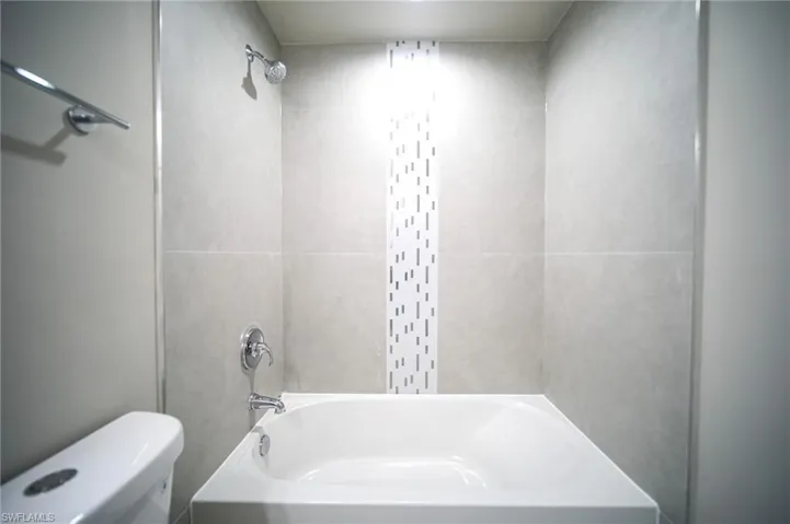 The Master Bathroom Has A Custom Tile Tub/Shower Area!