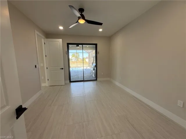 Empty room with a ceiling fan, recessed lighting, and light wood-style flooring