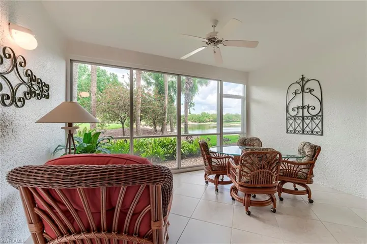 Sunroom / solarium with a water view