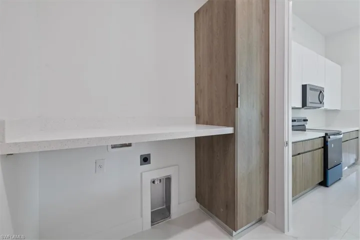 Laundry area featuring hookup for an electric dryer and laundry area