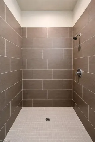 Full bathroom featuring tiled shower