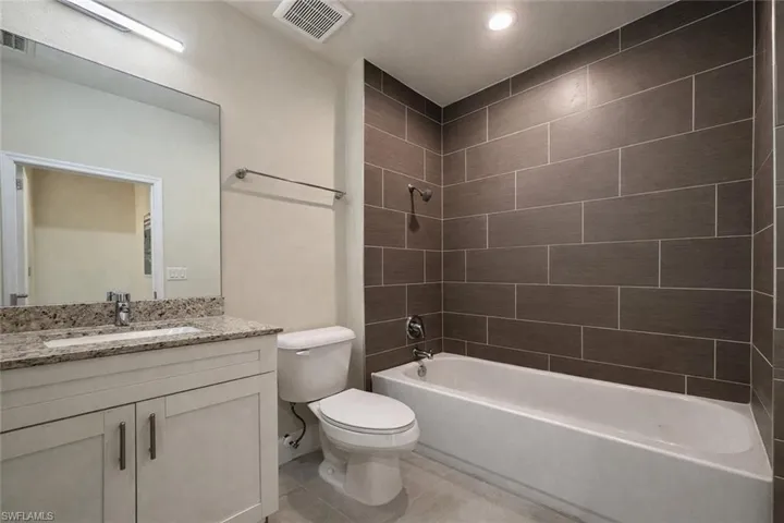 Full bathroom featuring shower / bathtub combination and vanity