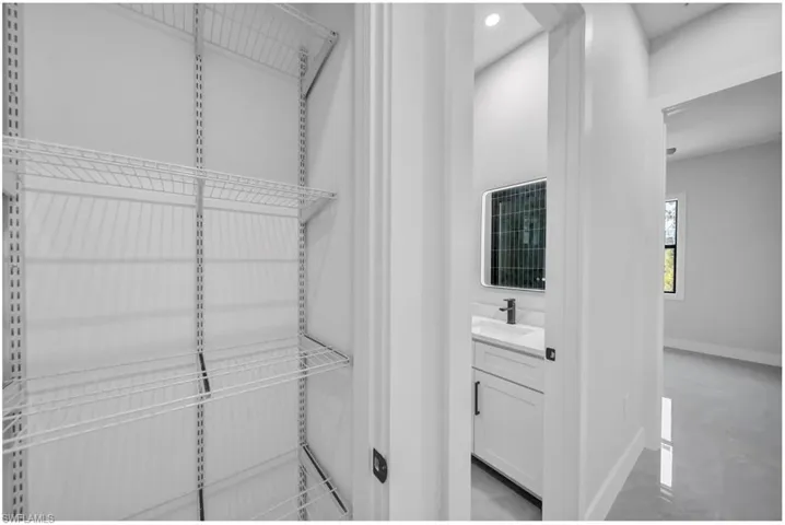 Spacious closet featuring a sink