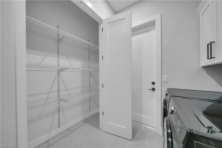 Washroom featuring washer and dryer
