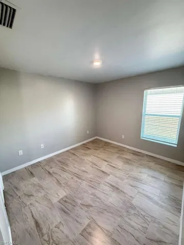 Spare room with baseboards